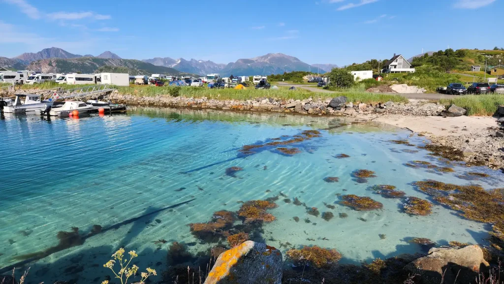 Still waters at the harbour in Sommarøy on a peaceful summer evening.